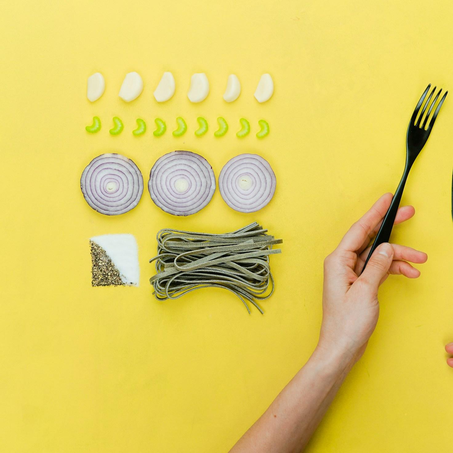Diverse group of community members sharing a meal together, showcasing the social bonds formed through collaborative cooking